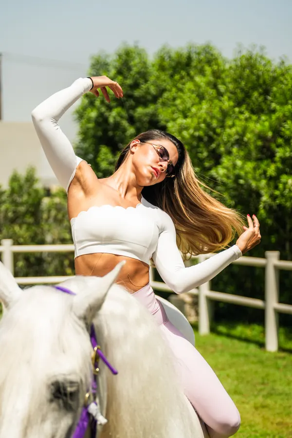 Dramatic editorial pose with horse at Crystalline Equine