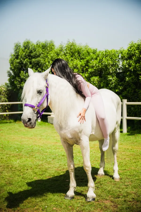 Mounted editorial shot in front of the stables
